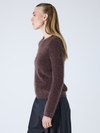 brown crew neck jumper with long sleeves and fluffy texture side view