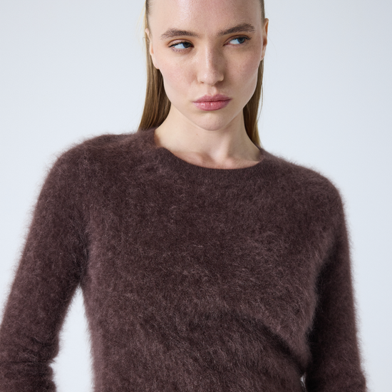 brown crew neck jumper with long sleeves and fluffy texture close up