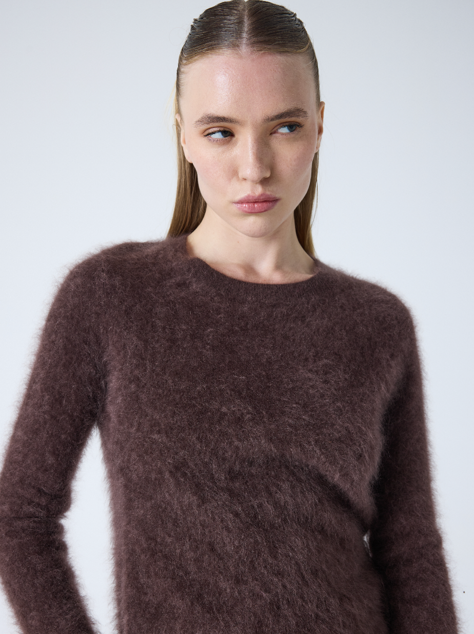 brown crew neck jumper with long sleeves and fluffy texture close up