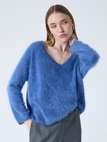 blue v neck jumper with long sleeves and fluffy texture