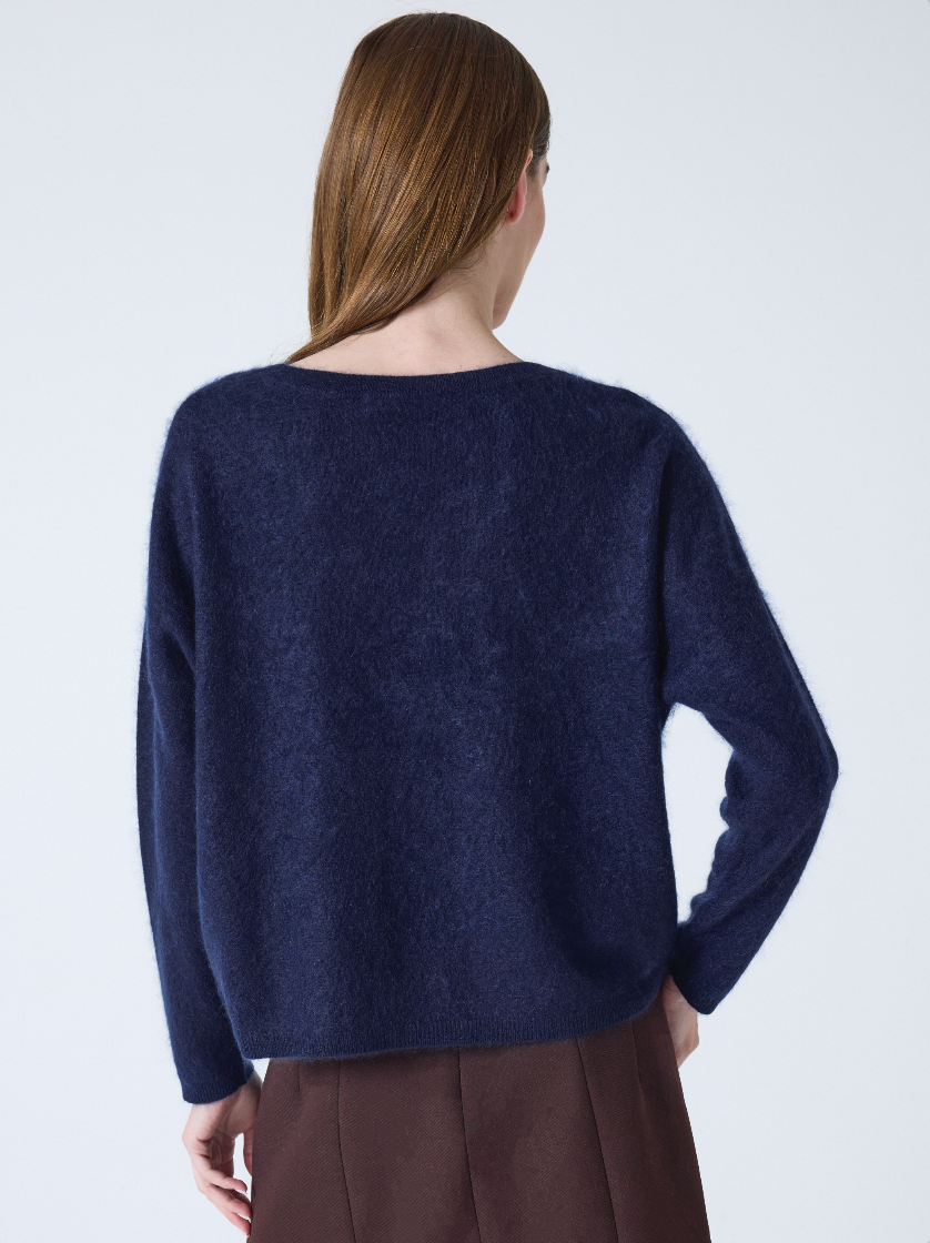 navy v neck jumper with long sleeves and fluffy texture rear view