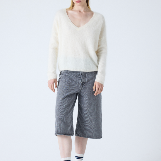 cream v neck jumper with long sleeves and fluffy texture model shot