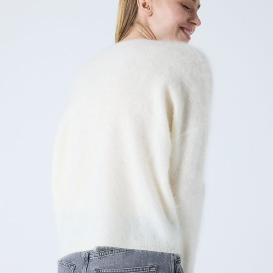 cream v neck jumper with long sleeves and fluffy texture rear view 