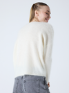 cream v neck jumper with long sleeves and fluffy texture rear view 