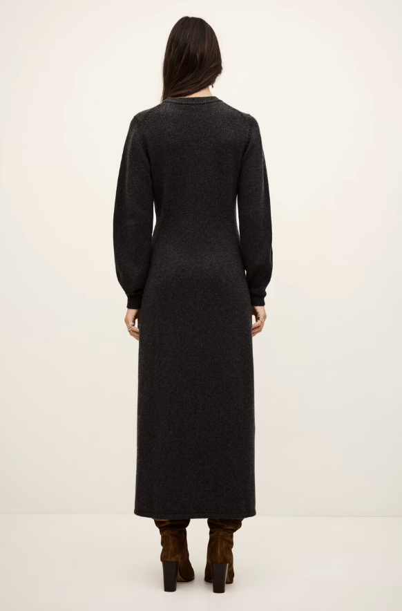 charcoal grey knitted long dress with round neck, ruche detailing with a statement crystal brooch and balloon sleeves rear view