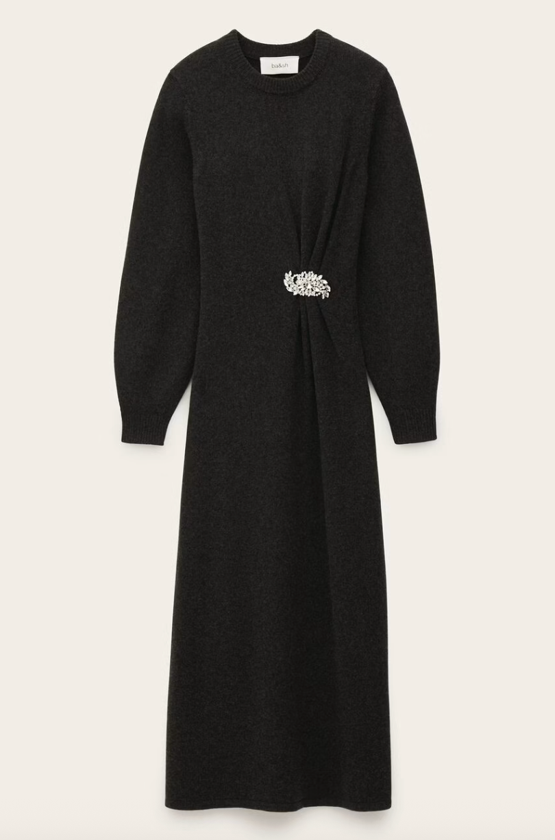 charcoal grey knitted long dress with round neck, ruche detailing with a statement crystal brooch and balloon sleeves