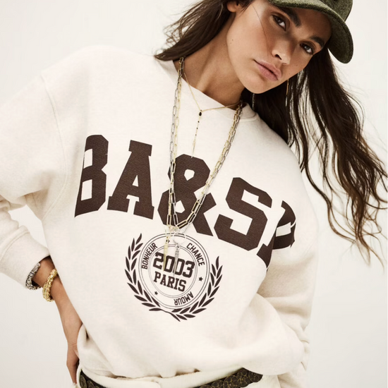 ecru sweatshirt with chocolate brown wording on the front from ba&sh model shot