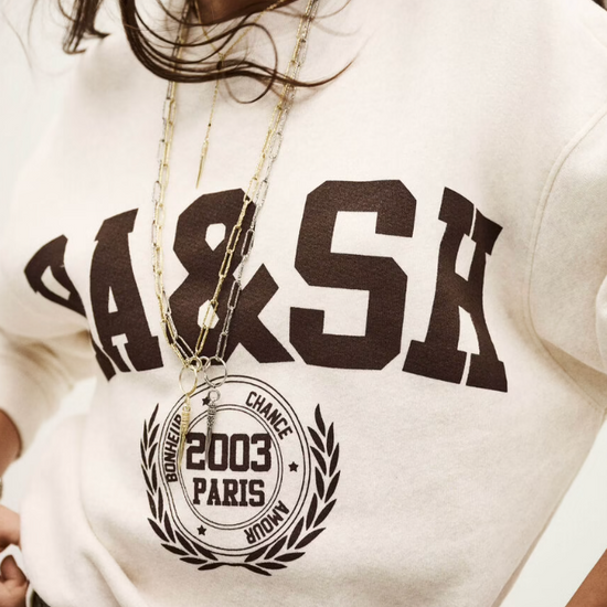 ecru sweatshirt with chocolate brown wording on the front from ba&sh model shot