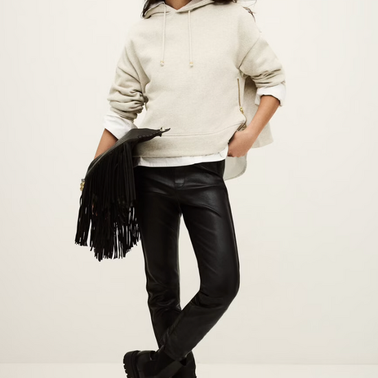 beige hoodie with gold zip sides and drawstring neck from ba&sh model shot