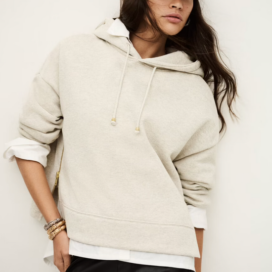 beige hoodie with gold zip sides and drawstring neck from ba&sh model shot