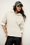 beige hoodie with gold zip sides and drawstring neck from ba&sh model shot