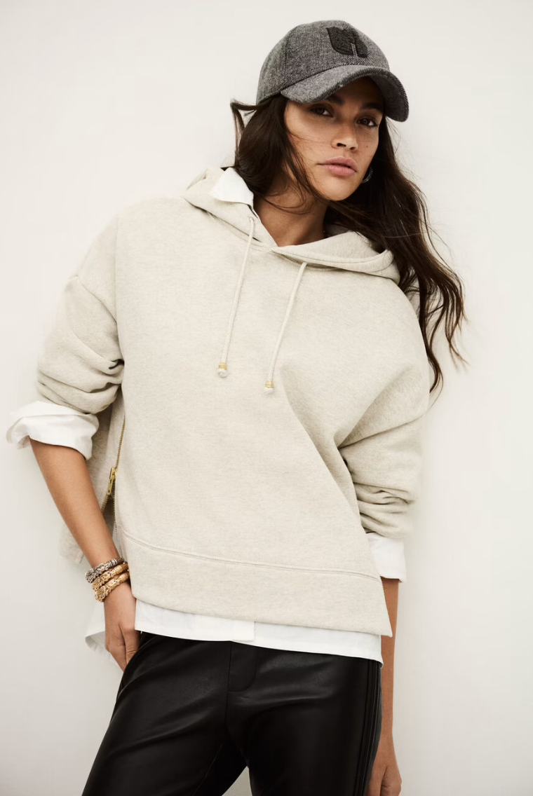 beige hoodie with gold zip sides and drawstring neck from ba&sh model shot