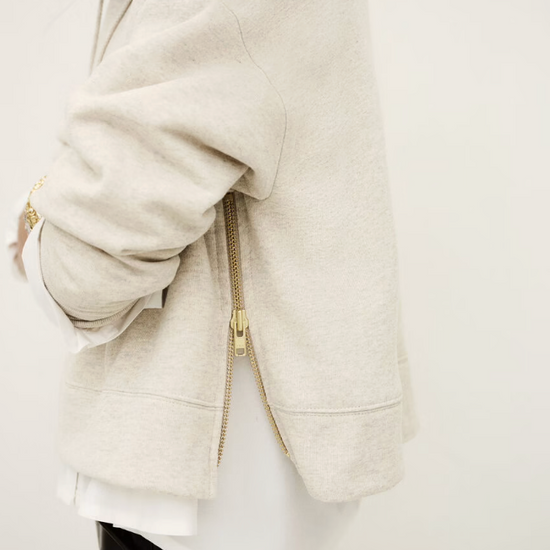 beige hoodie with gold zip sides and drawstring neck from ba&sh side view