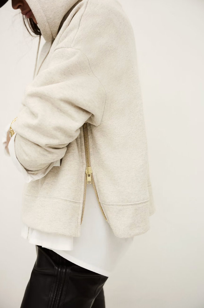beige hoodie with gold zip sides and drawstring neck from ba&sh side view