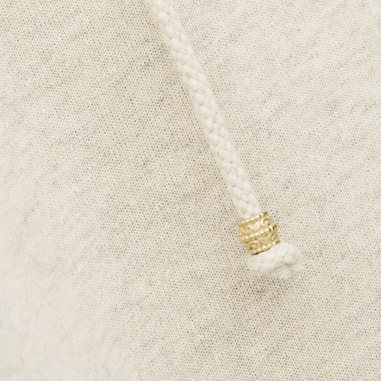 beige hoodie with gold zip sides and drawstring neck from ba&sh close up