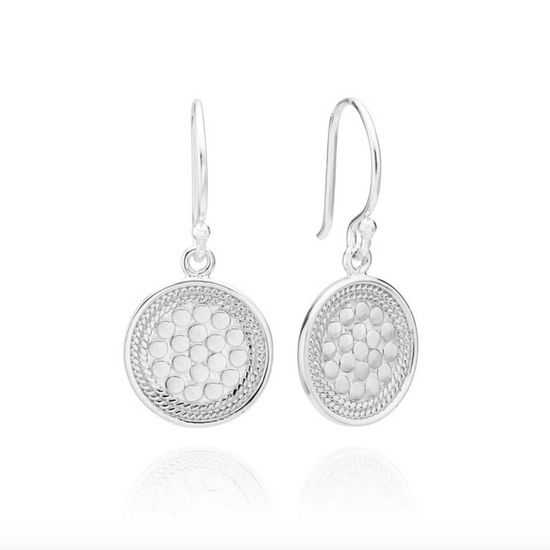 Pair of silver earrings with textured design on a white background from Anna Beck