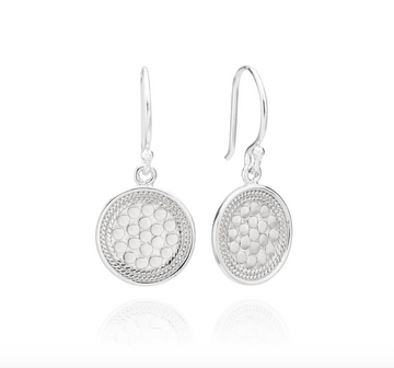 Pair of silver earrings with textured design on a white background from Anna Beck