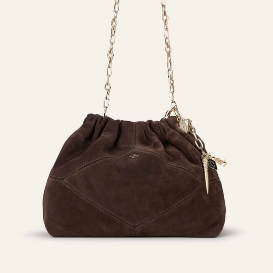 chocolate brown suede bucket style bag with gold chain strap and bag charm from ba&sh
