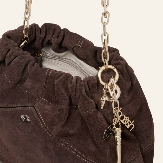 chocolate brown suede bucket style bag with gold chain strap and bag charm from ba&sh close up