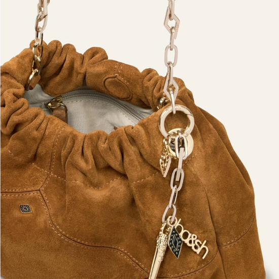deep tan suede small bucket style bag with bag charm from ba&sh inside view