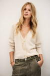 beige v neck wool mix cardigan with 3 gold buttons, rib detailing and a boxy fit from ba&sh model shot