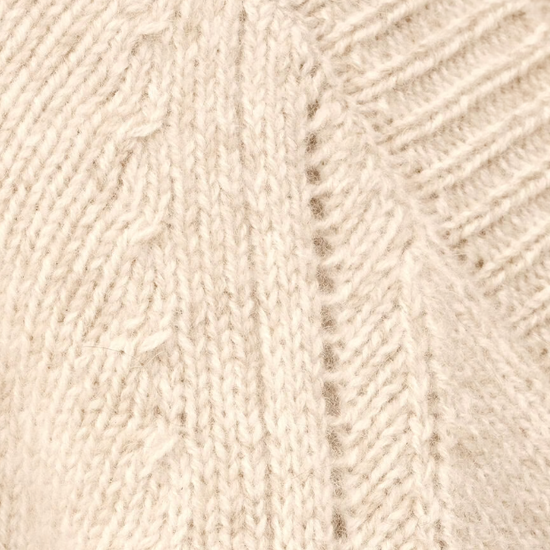 beige v neck wool mix cardigan with 3 gold buttons, rib detailing and a boxy fit from ba&sh close up of fabric