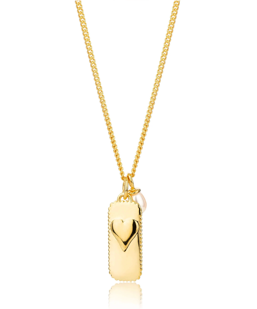 rectangular gold pendant with heart on one side and glimmer written on the other with pearl from claudia bradby