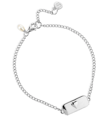 silver bracelet with rectangular pendant with a heart on one side and glimmers written on the other from claudia bradby