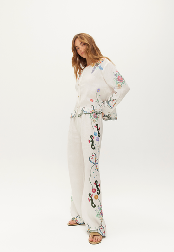 white linen trousers with embroidered detailing down the leg from me369