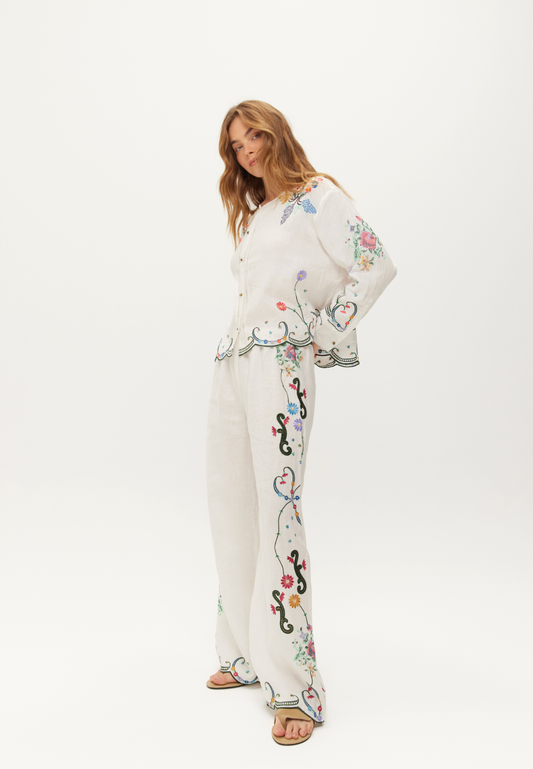 white linen trousers with embroidered detailing down the leg from me369