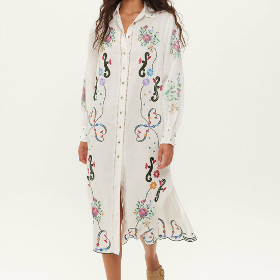 white linen shirt dress with embroidered detailing throughout