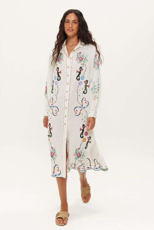 white linen shirt dress with embroidered detailing throughout