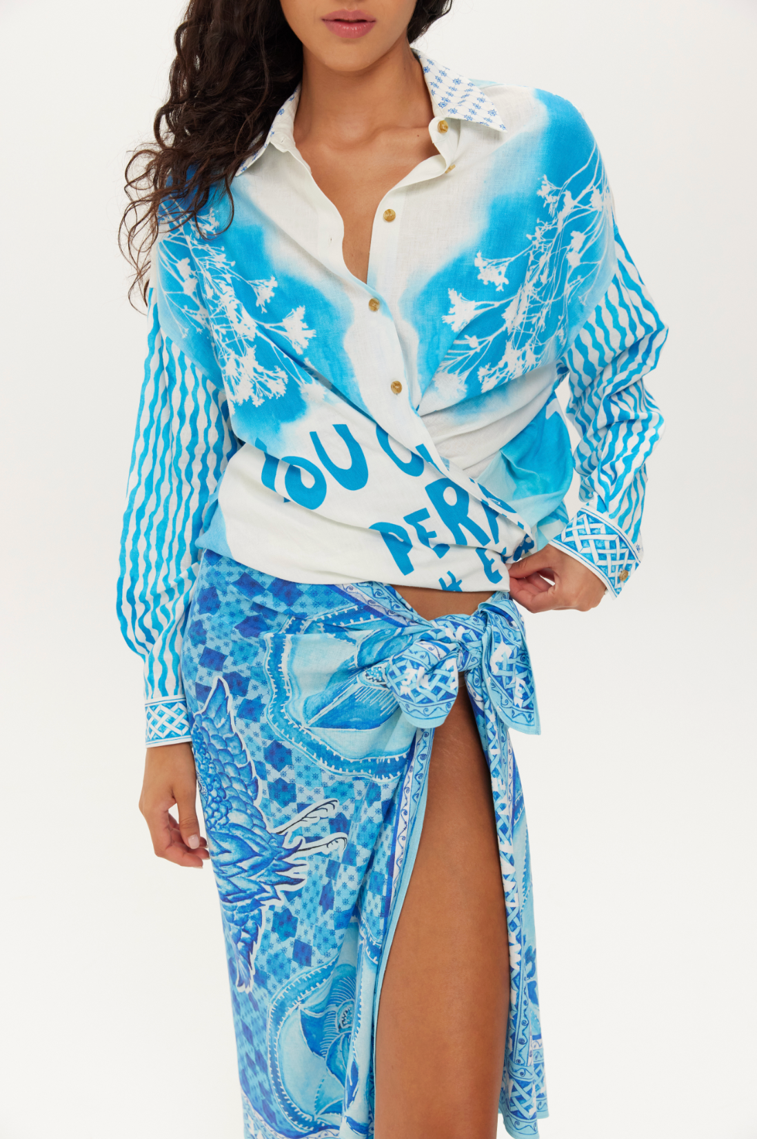 large blue print scarf which is being used as a skirt 