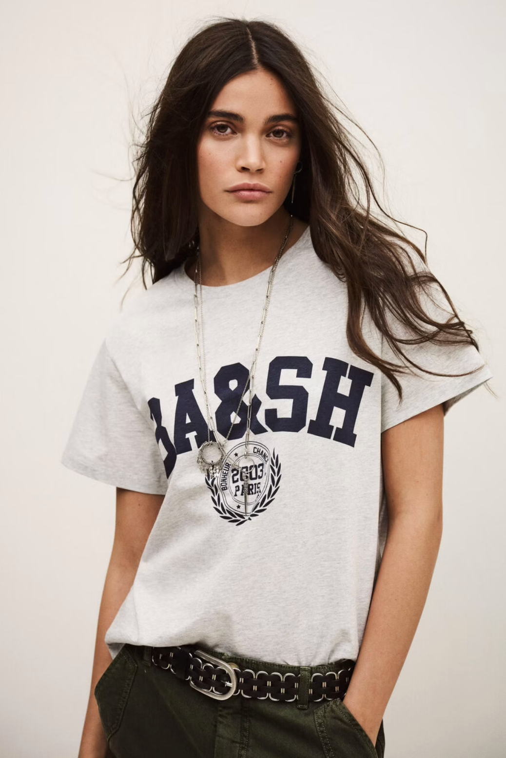 short sleeve light grey t shirt with dark navy bash on the front model