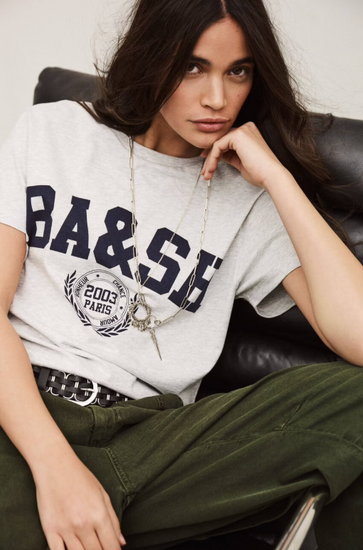 short sleeve light grey t shirt with dark navy bash on the front model