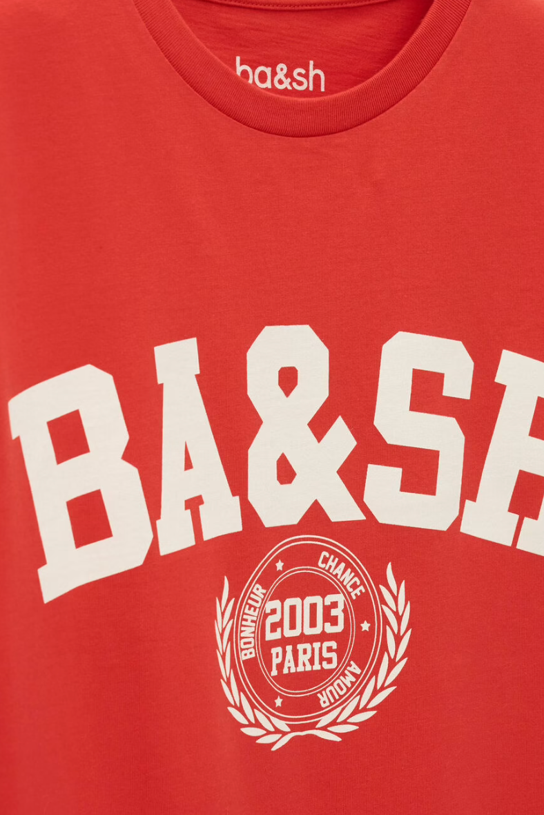 ned tshirt with white bash on the front  close up