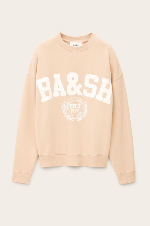 light pink long sleeve sweatshirt with white bash on the front