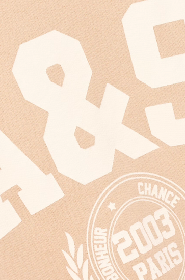 light pink long sleeve sweatshirt with white bash on the front close up