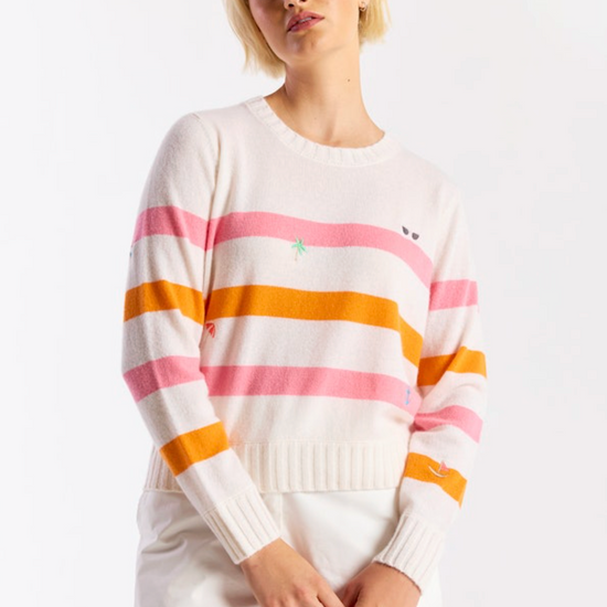 Woman wearing a striped sweater with a white background