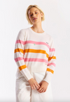 Woman wearing a striped sweater with a white background