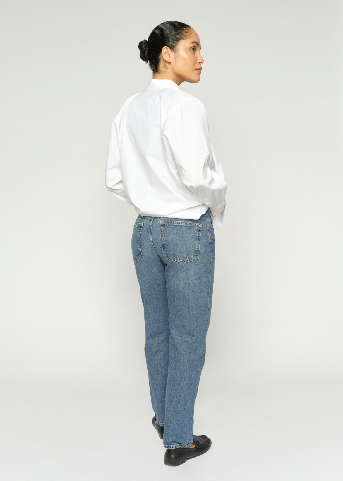 light blue denim straight leg jeans  model rear
