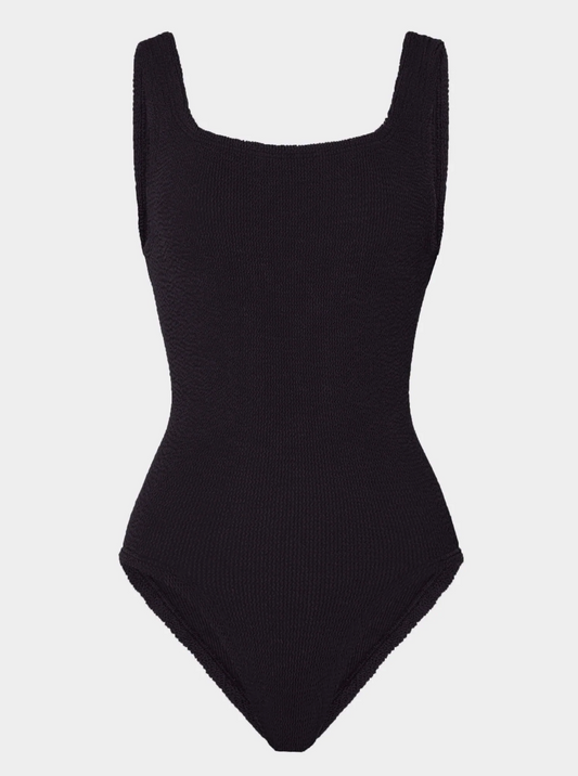 Flat lay picture of black one piece swimsuit, on whits background