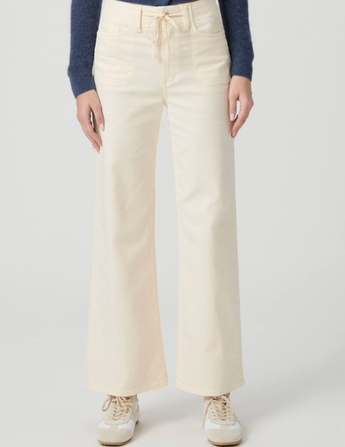 cream jeans with drawstring on a model on a white background