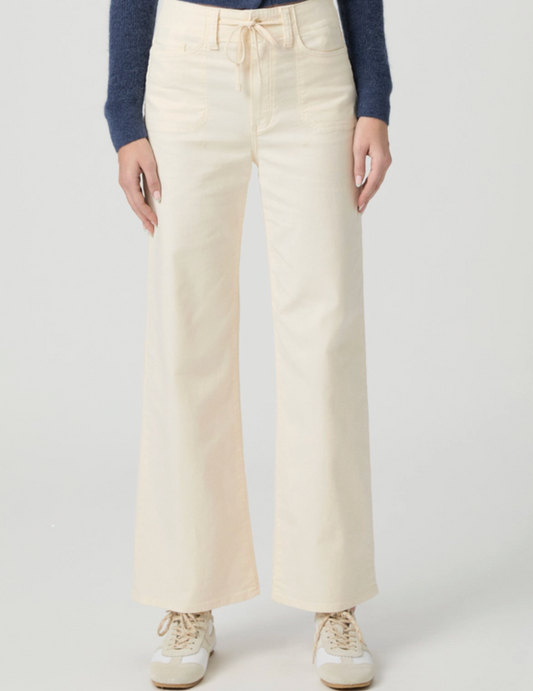 cream jeans with drawstring on a model on a white background