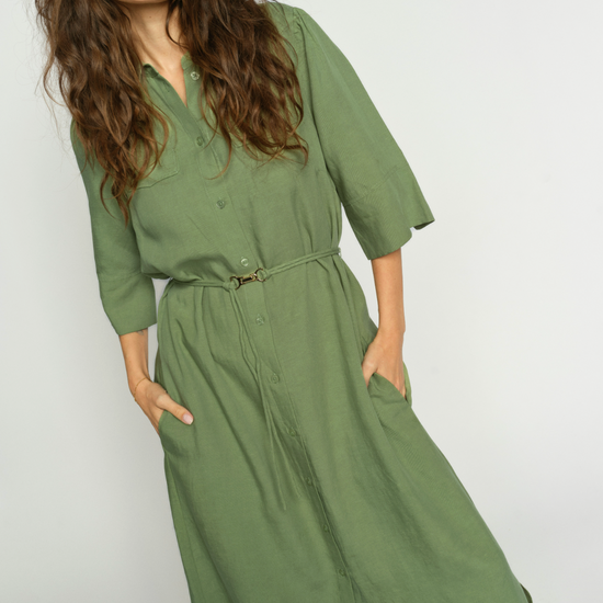 elbow length green shirt dress with belt and mid length model
