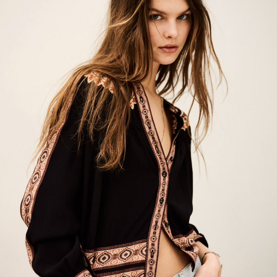 dark brown button down blouse with colourful paisley print from bash model