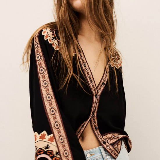 dark brown button down blouse with colourful paisley print from bash model