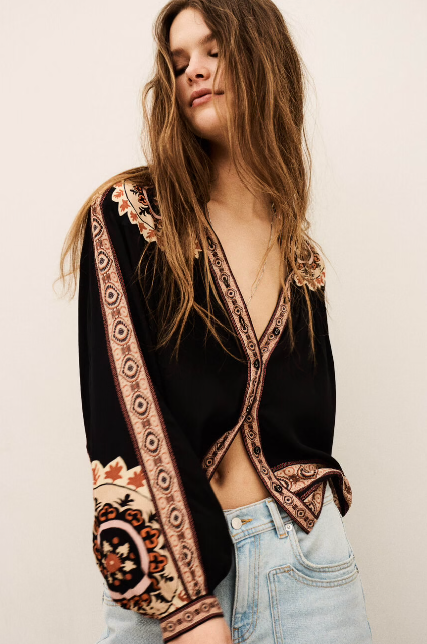 dark brown button down blouse with colourful paisley print from bash model