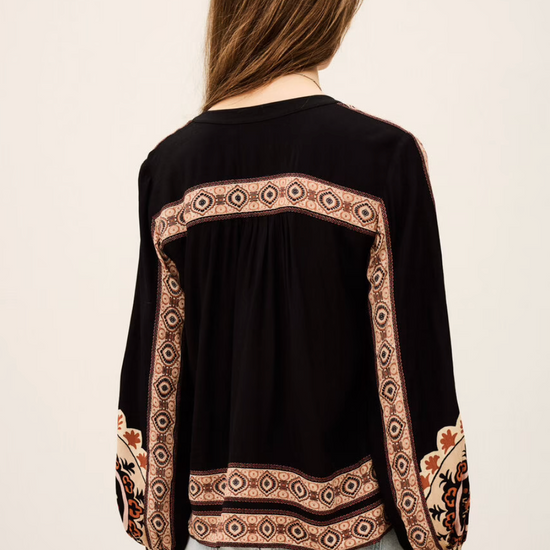dark brown button down blouse with colourful paisley print from bash model model rear