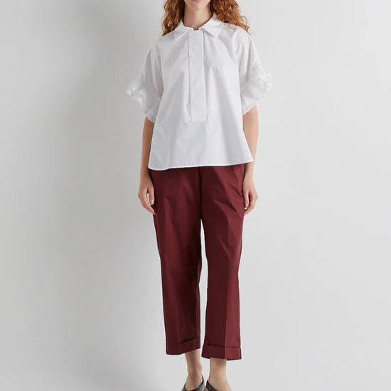White shirt with pleated shoulder detail